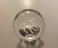 Beautiful glass ball with hologram  of  wolfs inside it