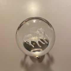 Beautiful glass ball with hologram  of  wolfs inside it