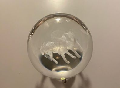 Beautiful glass ball with hologram  of  wolfs inside it