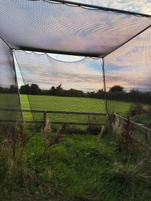 Golf hitting net with metal surround