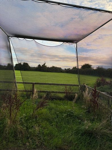 Golf hitting net with metal surround