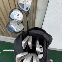 Older set of golf clubs with bag